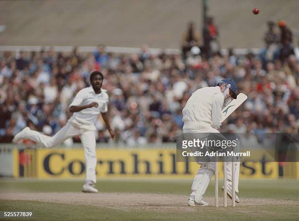 Michael Holding of the West Indies bowls a bouncer to Geoffrey Boycott of England during the third Cornhill test match on10 July 1980 at Old Trafford...