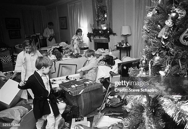 The children of Senator Robert F. Kennedy and Ethel Kennedy open presents on Christmas day, Hickory Hill, McLean, Virginia, December 25, 1967.