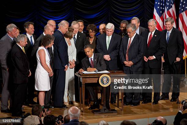 President Barack Obama signs the Dodd-Frank Wall Street Reform and Consumer Protection financial overhaul bill at the Ronald Reagan Building in...