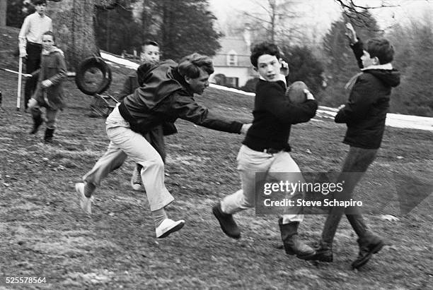 Senator Robert F. Kennedy plays touch football with his children at Hickory Hill, McLean, Virginia, December 24, 1967.