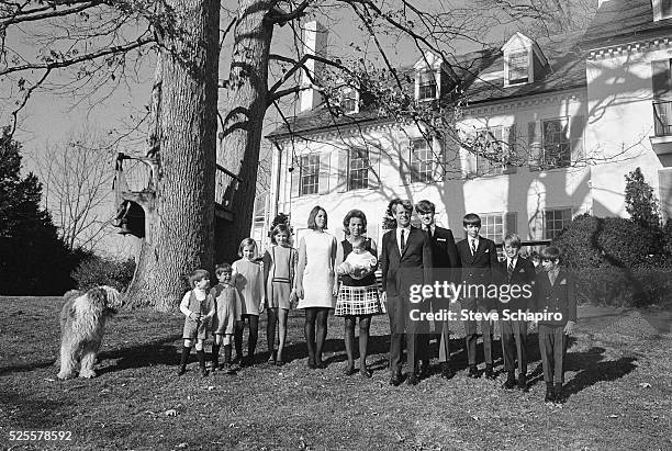 Senator Robert F. Kennedy and his wife Ethel and their children pose for a portrait outside their Hickory Hill home, McLean, Virginia, June 4, 1967....