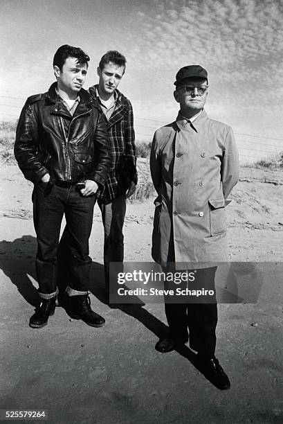 View of, from left, American actors Robert Blake and Scott Wilson , and author Truman Capote during the filming of 'In Cold Blood' , Kansas, 1967....