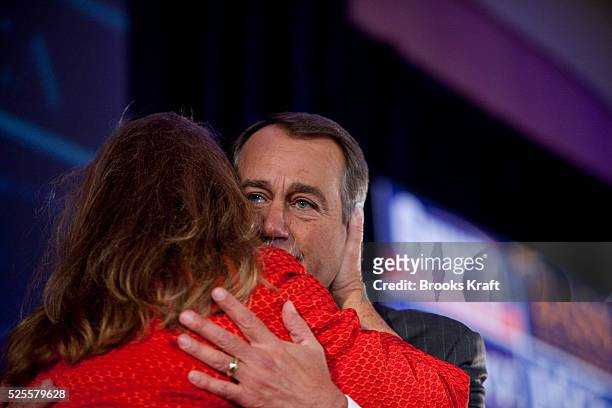 House Republican Leader John Boehner hugs his wife Debbie after he teared up during his speech to supporters at a Republican election night results...