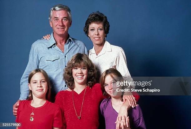 Actress Carol Burnett poses for a photograph with, front row from left to right, her daughters Erin, Carrie, Jody and her husband, Joseph Hamilton.