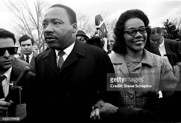 Martin Luther King holds hands with his wife Coretta Scott King as they embark on their 5-day march from Selma to Montgomery.