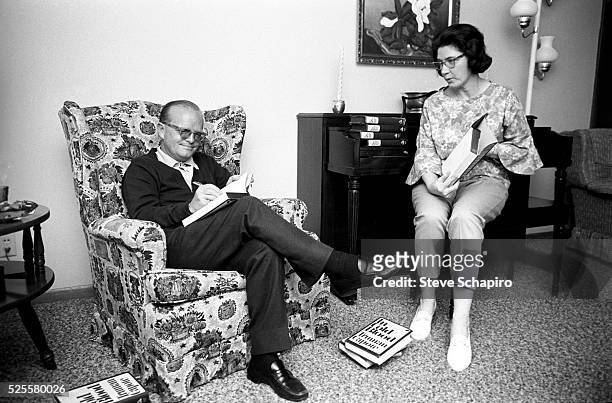 American author Truman Capote autographs copies of his non-fiction novel 'In Cold Blood' as he sits with Marie Dewey , Kansas, 1967. Capote was in...