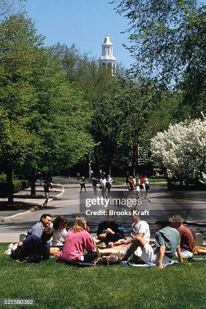 Students gather on a grassy area of Harvard Business School in Boston, one of the graduate schools of Harvard University, and one of the world's...