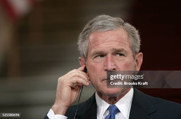 Georgian President Mikhail Saakashvili listens as U.S. President George W. Bush speaks during a joint news conference at the Georgian Parliament in...