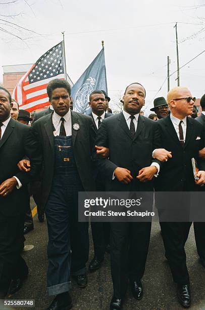 Reverend Jesse Douglas, Reverend Martin Luther King and James Forman leading the march from Selma to Montgomery to protest lack of voting rights for...