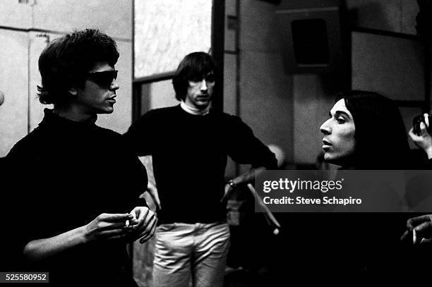 Lou Reed, Sterling Morrison and John Cale talking in the studio.