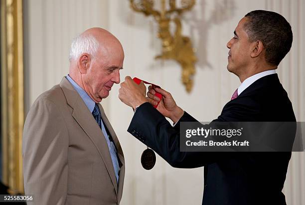 President Barack Obama presents a 2010 National Humanities Medal to author and conservationist Wendell E. Berry, during a ceremony in the East Room...