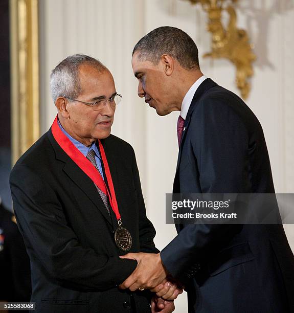 President Barack Obama presents a 2010 National Humanities Medal to Arnold Rampersad, during a ceremony in the East Room of the White House in...