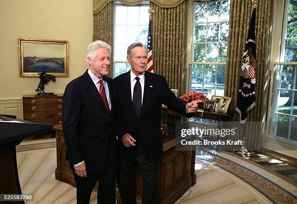 Former President Bill Clinton and former President George H.W. Bush in the Oval Office at the White House in Washington, September 1, 2005. President...