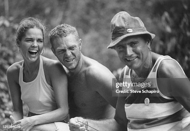 Ali MacGraw, Steve McQueen and an unidentified man share a laugh during a break in filming Papillon.