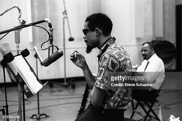 Composer and horn player Eric Dolphy during the recording sessions for George Russell's Ezz-thetics album at Riverside Studios. David Baker,...