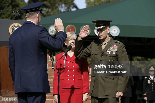 Incoming Chairman of the Joint Chiefs U.S. Marine Gen. Peter Pace, right, is sworn-in by outgoing Chairman of the Joint Chiefs of Staff U.S.A.F. Gen....