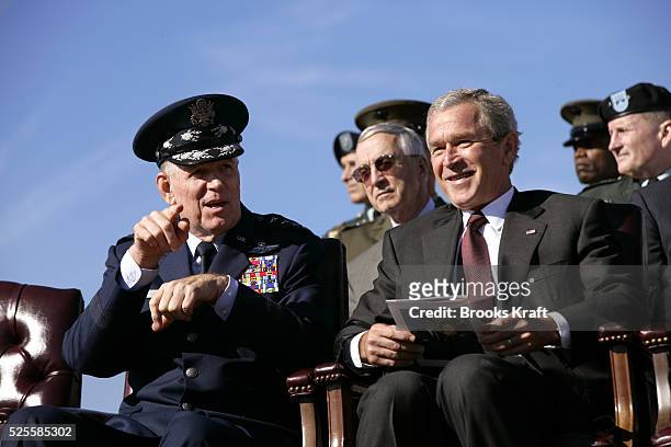 President George W. Bush, right, participates in the Armed Forces Farewell Tribute in Honor of General Richard B. Myers, left, and Armed Forces Hail...