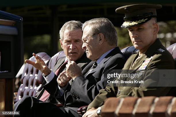 Incoming Chairman of the Joint Chiefs U.S. Marine Gen. Peter Pace, right, sits next to U.S. President George W. Bush, left,and Secretary of Defense...