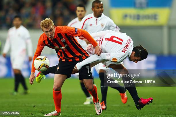 Viktor Kovalenko of Shakhtar is challenged by Grzegorz Krychowiak of Sevilla during the UEFA Europa League Semi Final first leg match between...