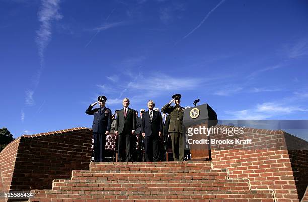 President Bush, second from left, and Secretary of Defense Donald Rumsfeld, third from left, participate in an Armed Forces farewell tribute in honor...