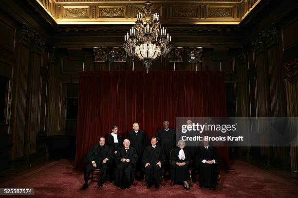 Justices of the U.S. Supreme Court gather for an official picture, their first since December 2003, at the Supreme Court in Washington, D.C., October...