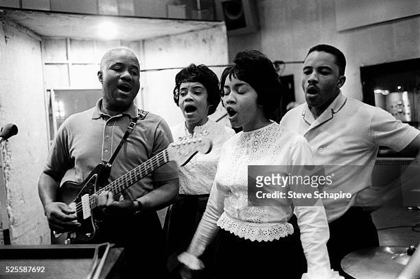 Family members in band The Staple Singers in a recording studio.