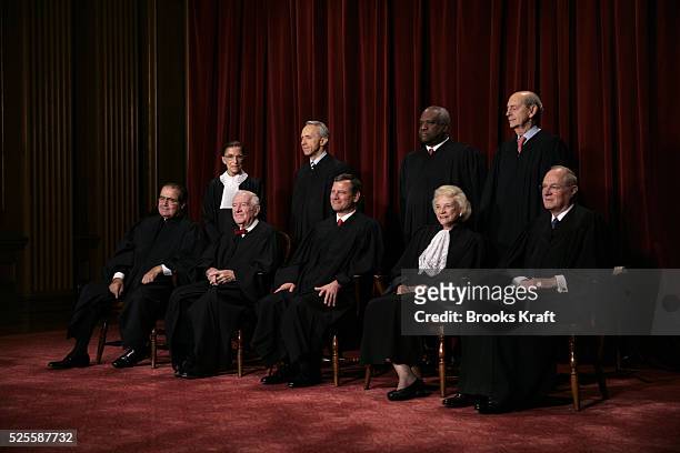 Justices of the U.S. Supreme Court gather for an official picture, their first since December 2003, at the Supreme Court in Washington, D.C., October...