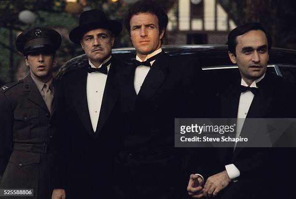 Al Pacino, Marlon Brando, James Caan and John Cazale stand in the 1972 movie The Godfather.