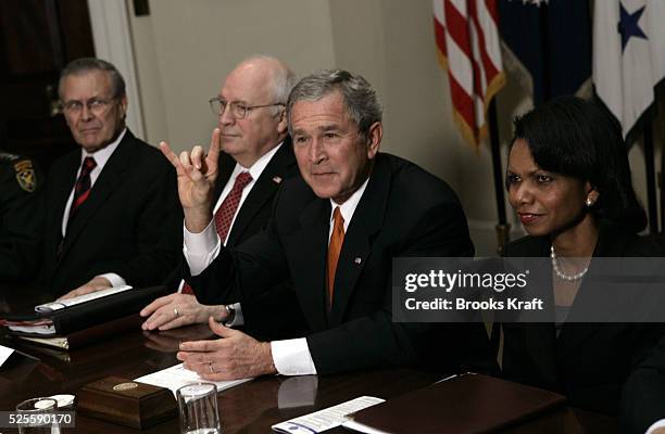 President George W Bush gives the sign for the college football team the Texas Longhorns, after a meeting about the war in Iraq with past and present...