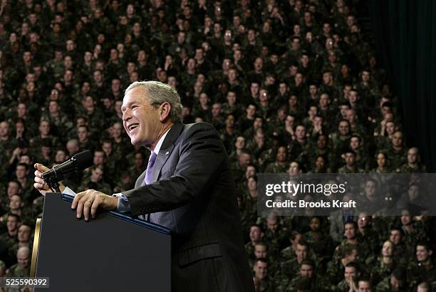 President George W. Bush speaks in front of soldiers who recently returned from Iraq at the Kansas State University in Manhattan, Kansas, January 23,...