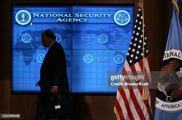 National Intelligence Director John Negroponte walks past a video screen during a visit by U.S. President George W. Bush at the National Security...