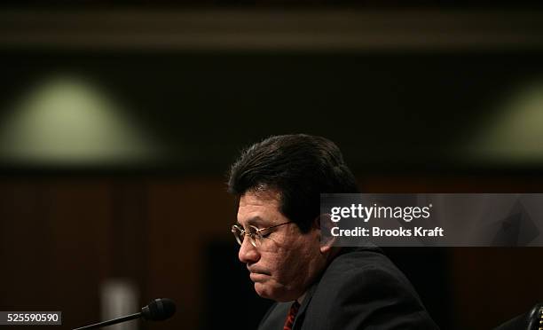 Attorney General Alberto Gonzales listens to questions from the Senate Judiciary Committee on whether the Bush Administration acted illegally in...