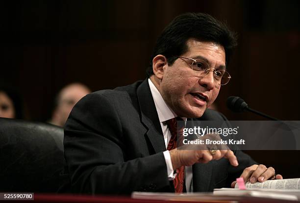 Attorney General Alberto Gonzales points to a copy of the Foreign Intelligence Surveillance Act during testimony 06 February 2006 before the Senate...