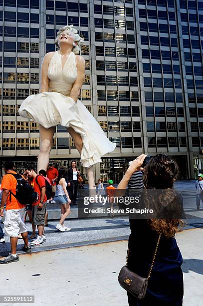 Foot sculpture of Marilyn Monroe by Seward Johnson known as "Forever Marilyn," is unveiled in Pioneer Court, Chicago. Johnson's statue depicts the...