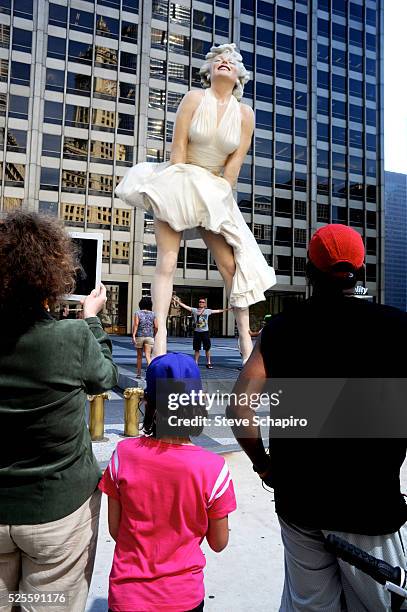 Foot sculpture of Marilyn Monroe by Seward Johnson known as "Forever Marilyn," is unveiled in Pioneer Court, Chicago. Johnson's statue depicts the...