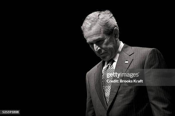 President George W. Bush answers a question from members of the audience after delivering a speech on the war in Iraq at the Arie Crown Theatre in...