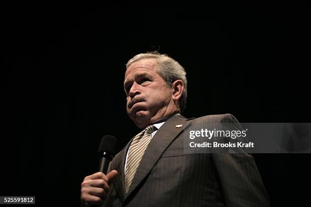 President George W. Bush answers a question from members of the audience after delivering a speech on the war in Iraq at the Arie Crown Theatre in...