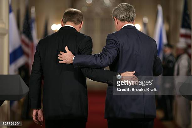 President George W. Bush and Israeli Prime Minister Ehud Olmert depart after a joint press availability in the East Room of the White House in...