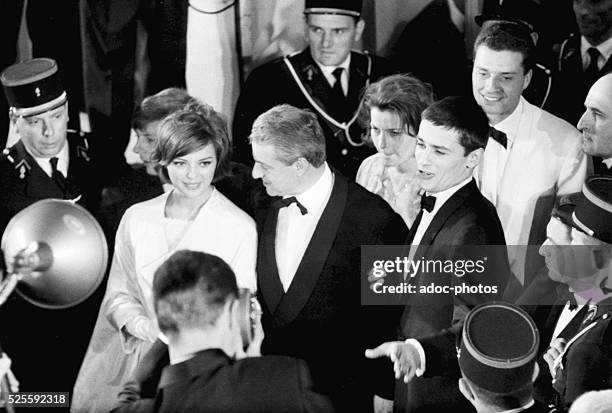 Barbara Lass, Ren�� Cl��ment and Alain Delon at the opening of the Cannes film festival in 1961.