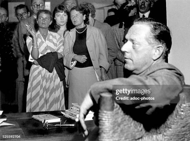 The American writer Erskine Caldwell during an autograph session in Paris . Ca. 1950.