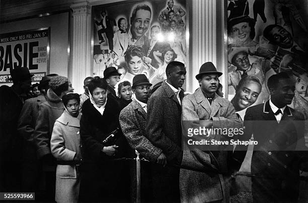 People waiting in line to get outside the Apollo Theater, New York, New York, 1960.
