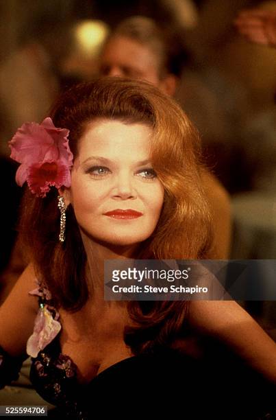 American actress Eileen Brennan , with a pink flower in her hair, as Betty DeBoop in a scene from the film, 'The Cheap Detective,' directed by Robert...