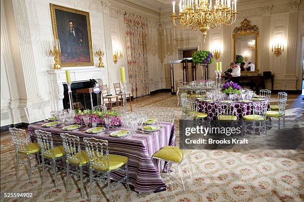 Table settings in the State Dining Room of the White House in Washington, ahead of a State Dinner hosted by President Barack Obama and first lady...