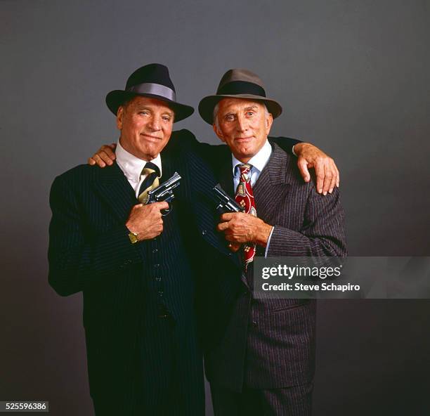 Burt Lancaster and Kirk Douglas posing in character for the movie Tough Guys
