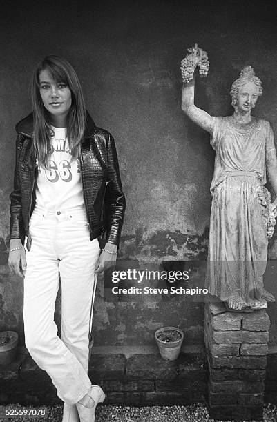 Portrait of French pop musician and actress Francoise Hardy as she poses beside a statue, Venice, Italy, September 1966.