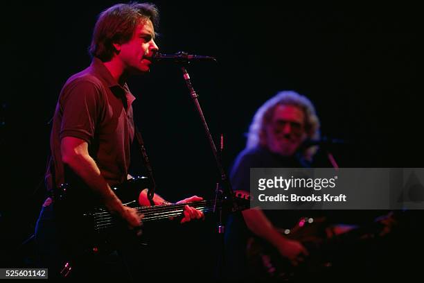 Bob Weir and Jerry Garcia of rock group The Grateful Dead perform on stage during a concert.