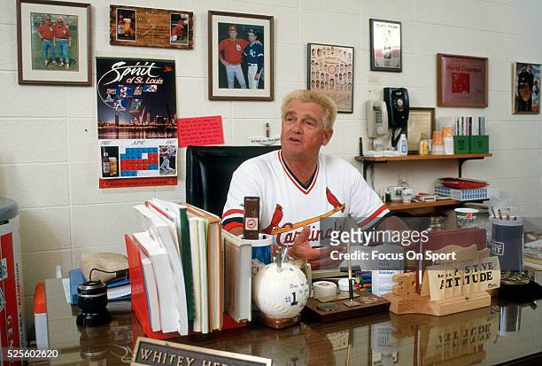Manager Whitey Herzog of the St. Louis Cardinals sits at his desk in his office prior to the start of a Major League Baseball game circa 1990 at...