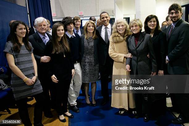 Democratic presidential hopeful Senator Barack Obama poses for a photo with members of the Kennedy family backstage before a rally at American...