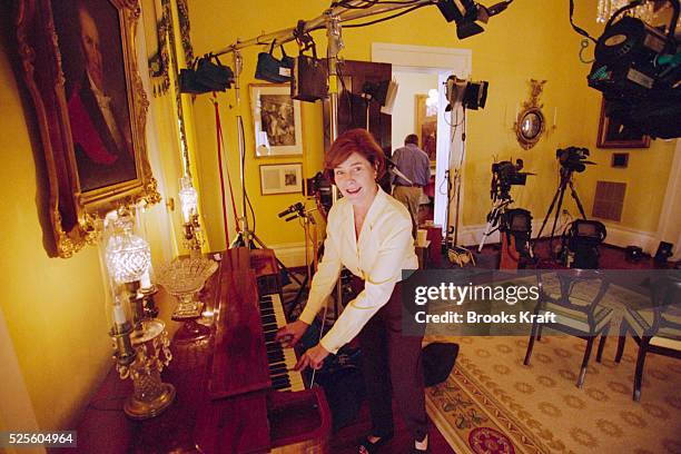 George Bush's wife Laura plays the piano while taking a break from a media event at the Governor's Mansion in Austin, Texas. Governor of Texas since...