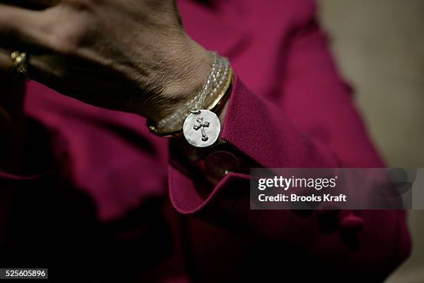 Religious charm is seen on the wrist of Democratic presidential hopeful Senator Hillary Rodham Clinton, as she speaks during a campaign stop at the...
